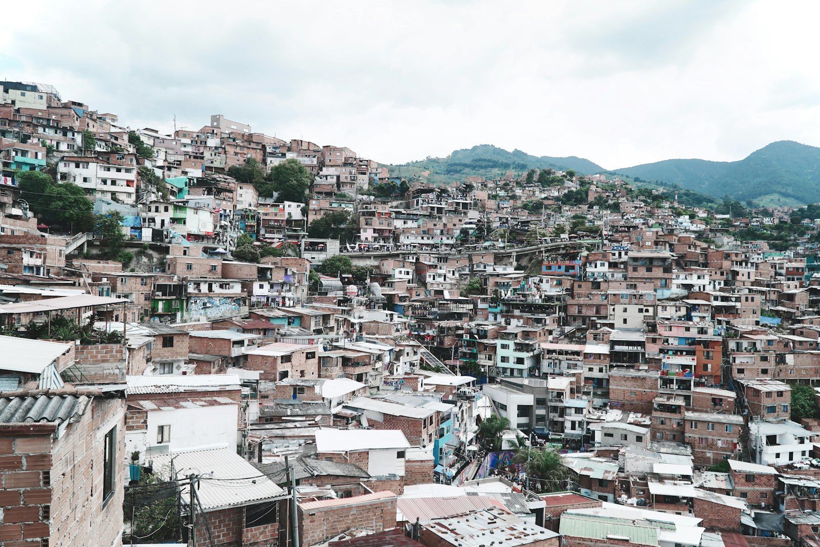 Dense hillside favela with many colorful buildings.